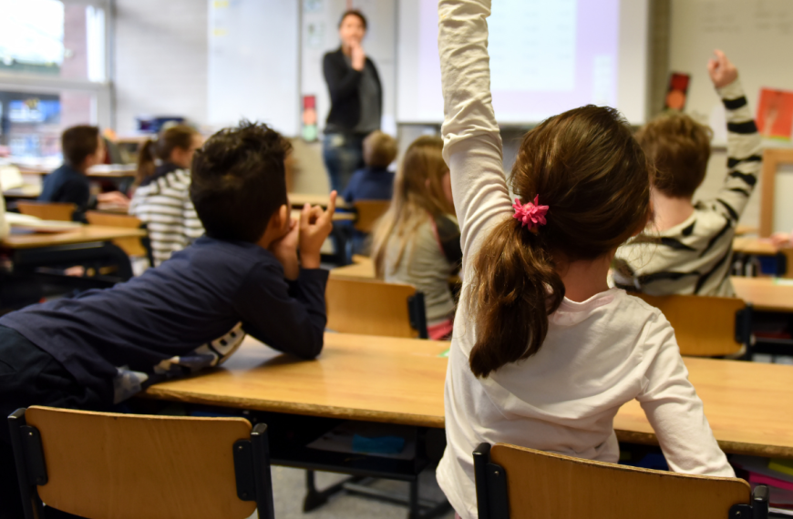 Teacher asking question to class.