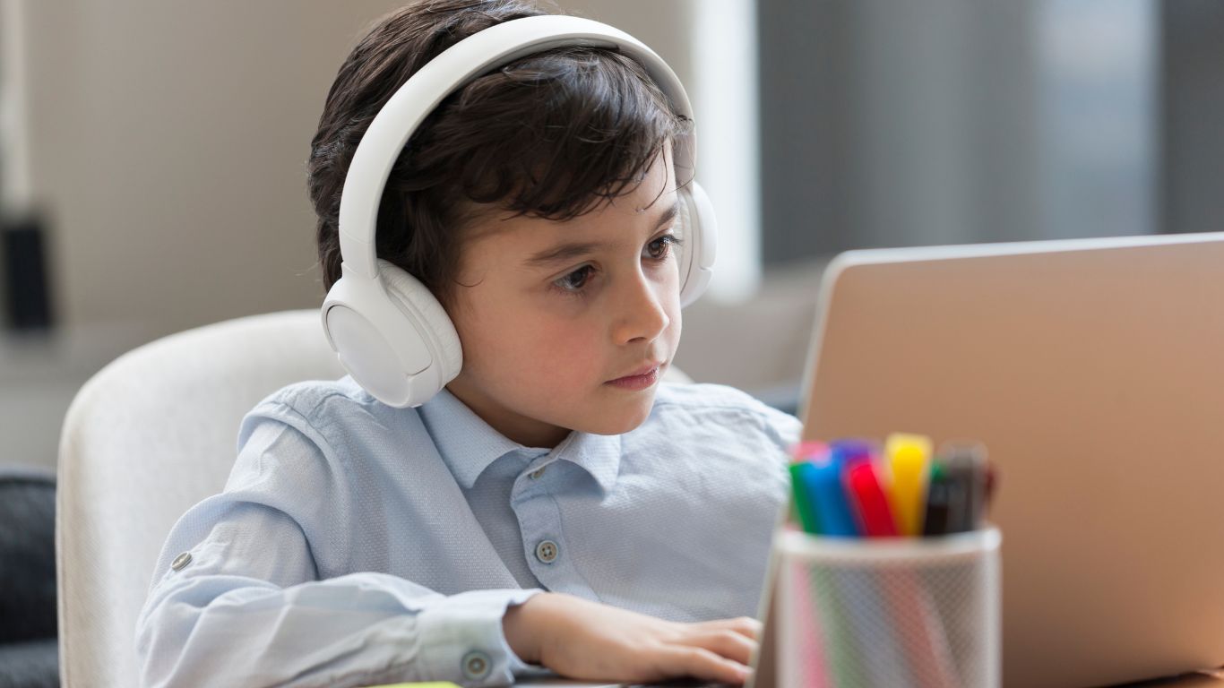 Boy focused on e-learning.